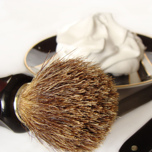 What should I do if my shaving brush starts to shed bristles?